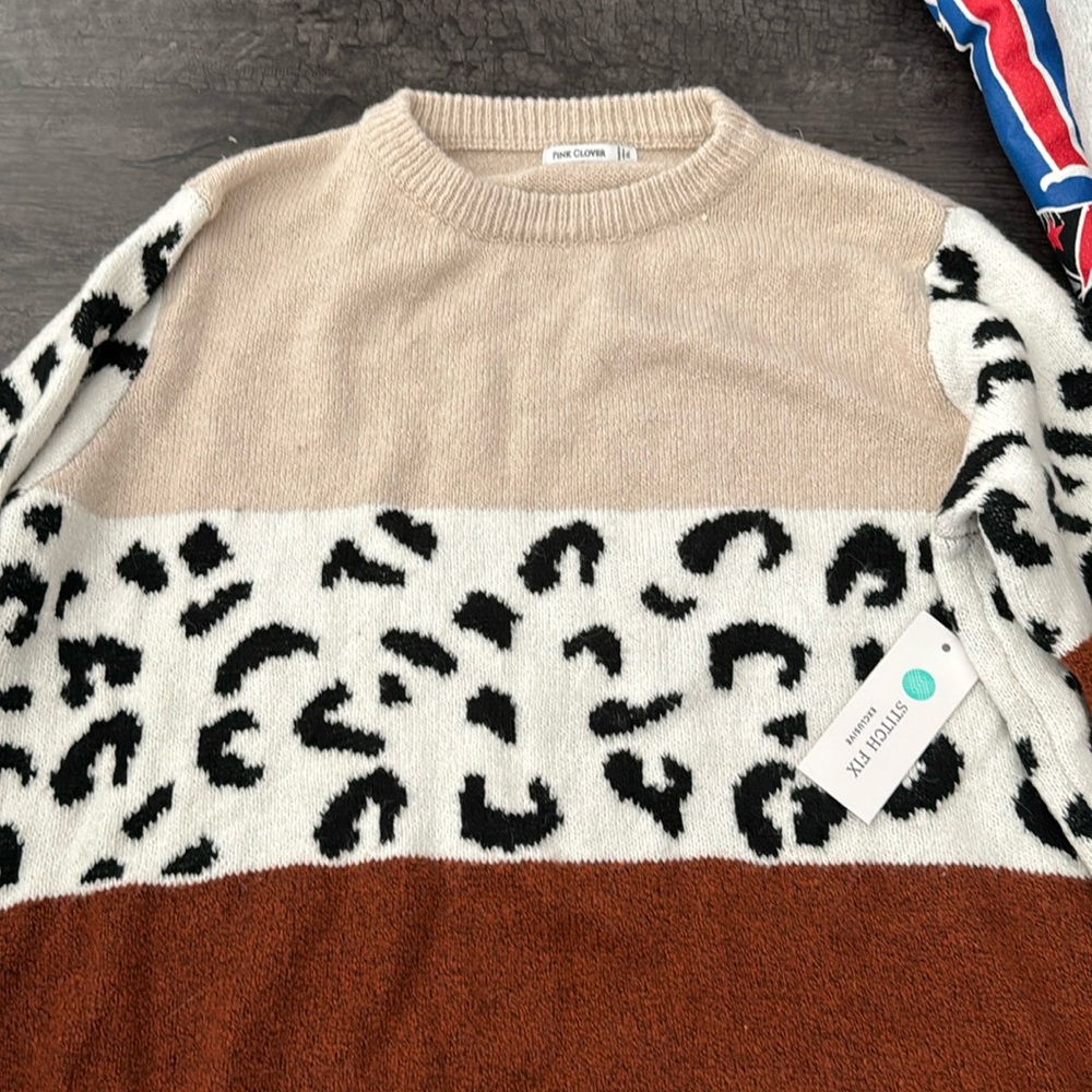 Brand new, animal print sweater with tags